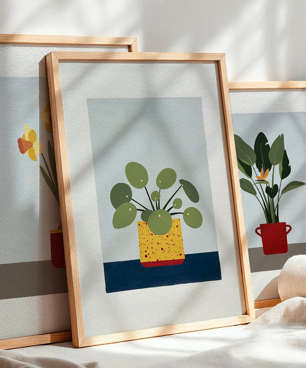 quadro di una pilea in un vaso giallo